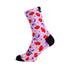 Chaussettes cyclisme Sox 777 motif cerises rouges sur fond rose pour cyclistes audacieux