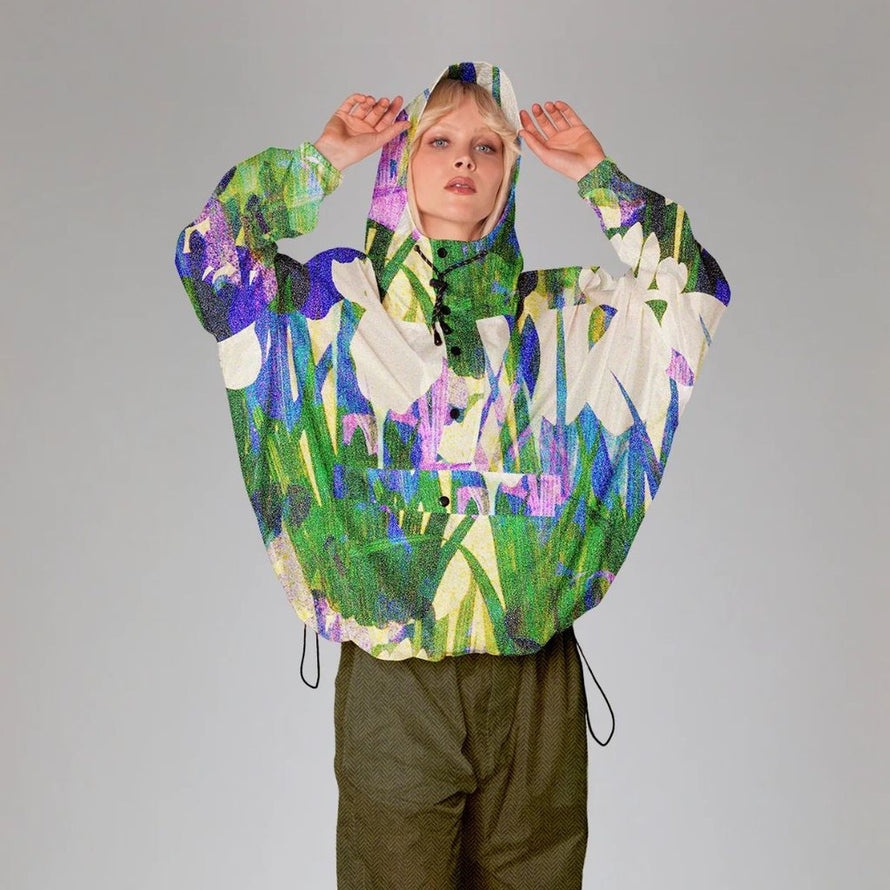 Anorak impermeable Rainkiss motif fleurs, protection elegante et fonctionnelle pour cyclistes urbains sous la pluie