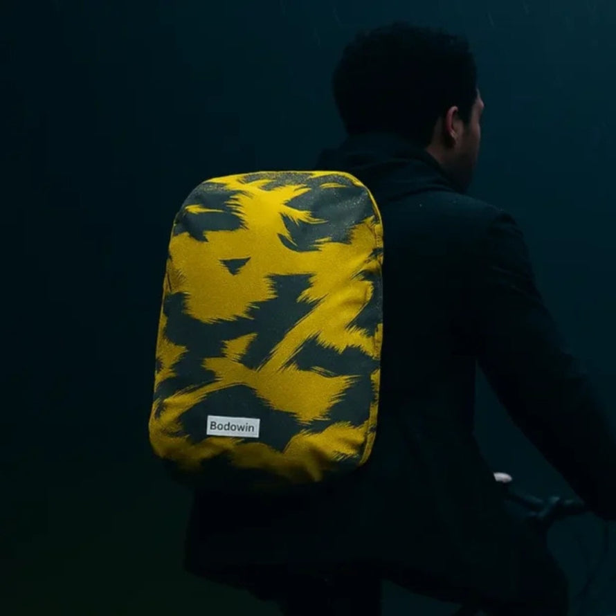 Housse de pluie imperméable et réfléchissante Badawin pour sac à dos vélo modèle jaune avec design moderne