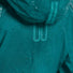 Veste vélo imperméable Basil Skane turquoise avec gouttes de pluie, respirante et adaptée aux cyclistes urbains