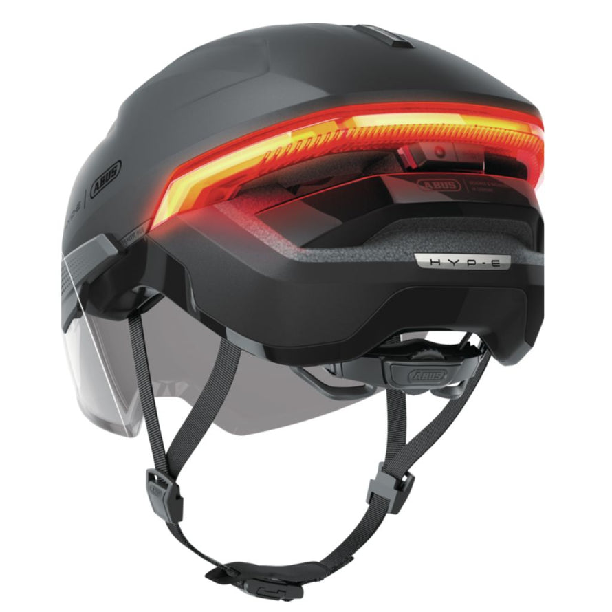 Casque urbain Abus Hyp-E avec éclairage arrière rouge et télécommande de contrôle.