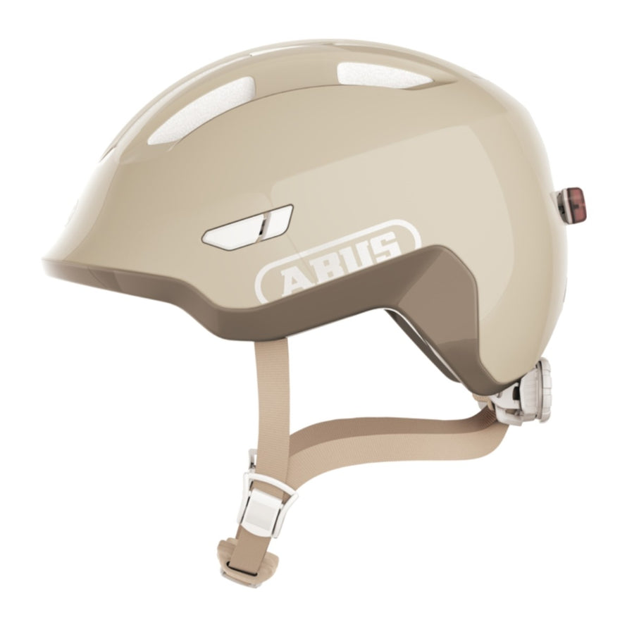 Casque vélo enfant Abus Smiley 3.0 FL.ACE LED beige avec éclairage arrière et fermeture magnétique sécurisée