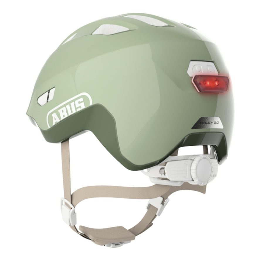 Casque vélo enfant Abus Smiley 3.0 FL.ACE LED vert sage avec éclairage arrière et fermeture magnétique sécurisée