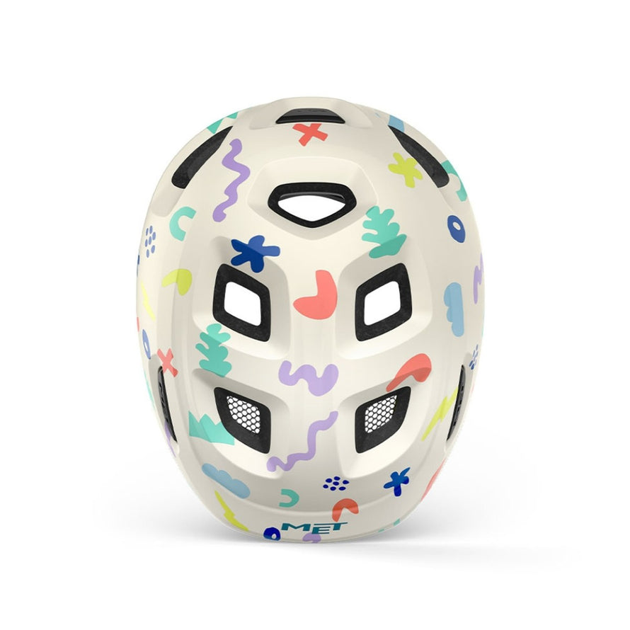 Casque vélo enfant Hourra MET motifs colorés sur fond clair, idéal pour siège vélo enfant sécurisé