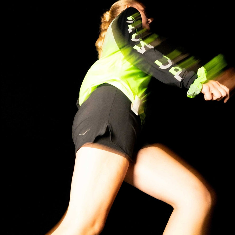 Chouchou reflechissant GoFluo vert neon pour cyclistes, optimise la visibilite en conditions de faible luminosite