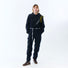 Vue frontale de la combinaison imperméable vélo ENTEGA Pignon Clothing unisexe avec capuche et ceinture