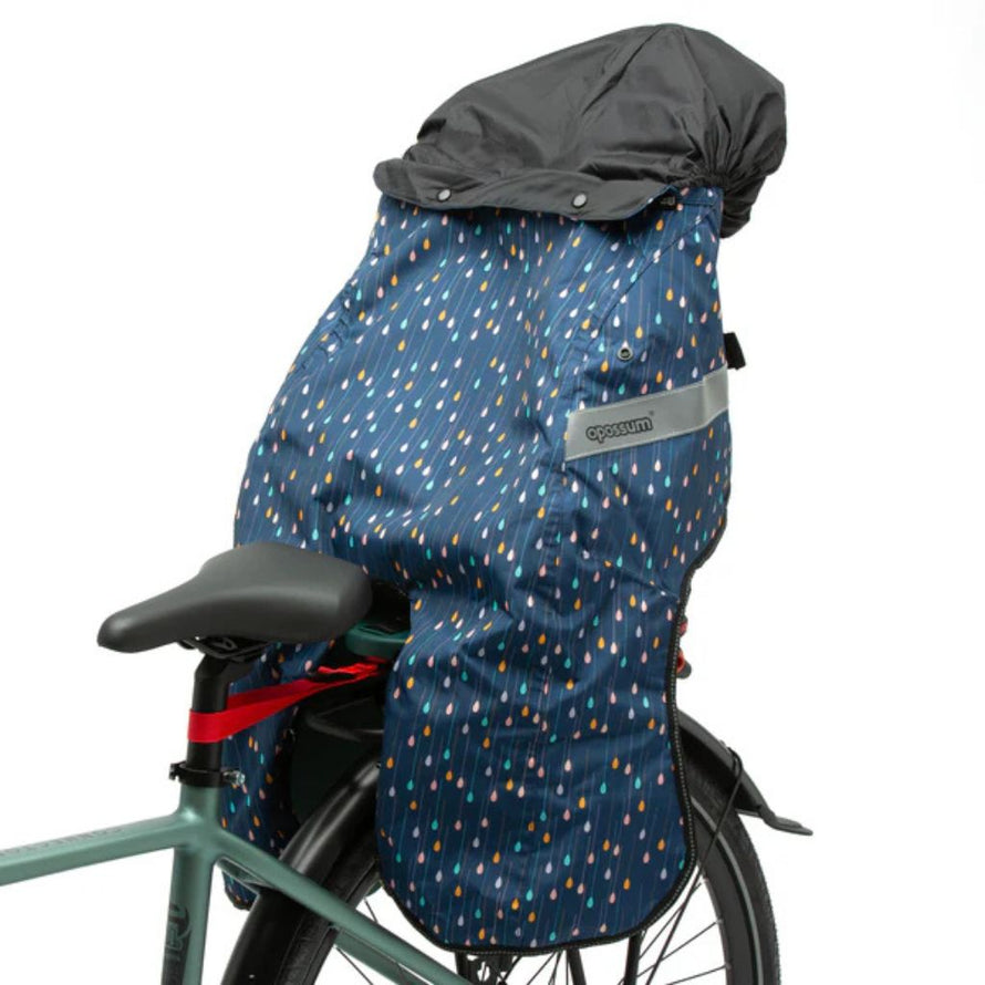 Coque Opossum Magic Splash bleue avec motif gouttes colorées, housse étanche pour siège arrière vélo