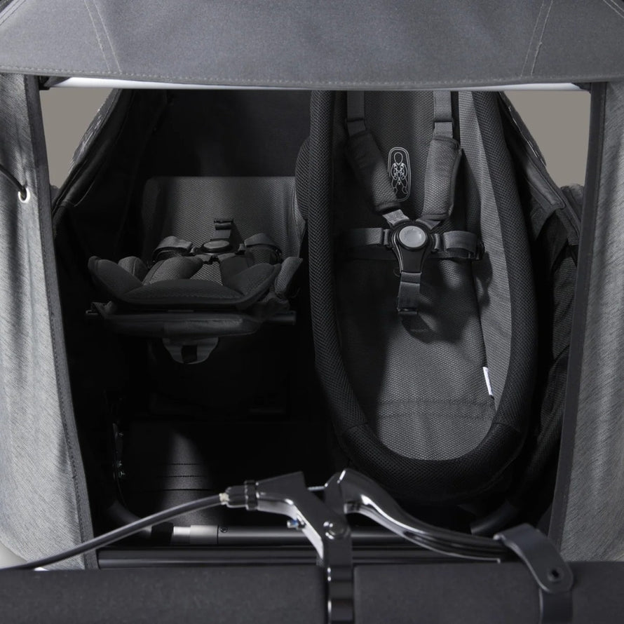 Couchette bebe Yuuna Croozer pour remorque velo, confort et securite pour les premiers trajets en famille