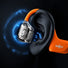 Vue detaillee de la technologie interne des ecouteurs velo Shokz OpenFit Air 2 avec arceau orange