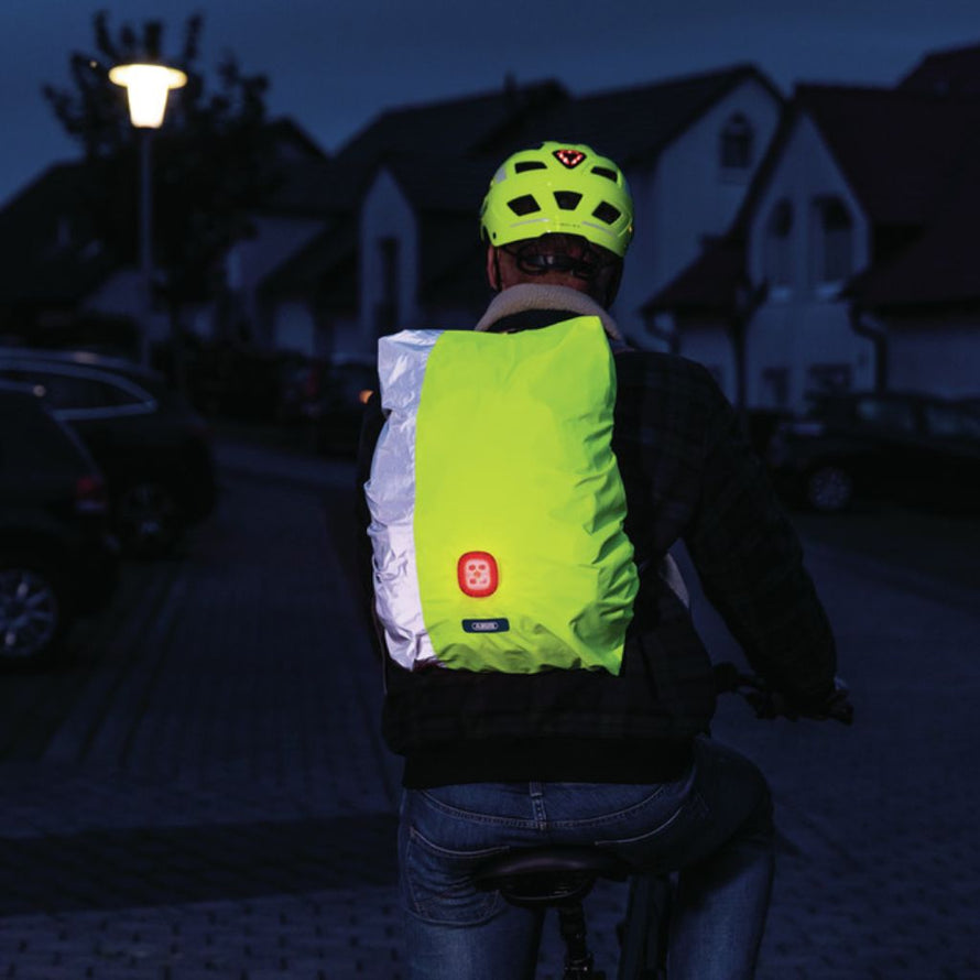 Housse de sac à dos réfléchissante et lumineuse pour cyclistes Abus Lumino Night Cover Yellow