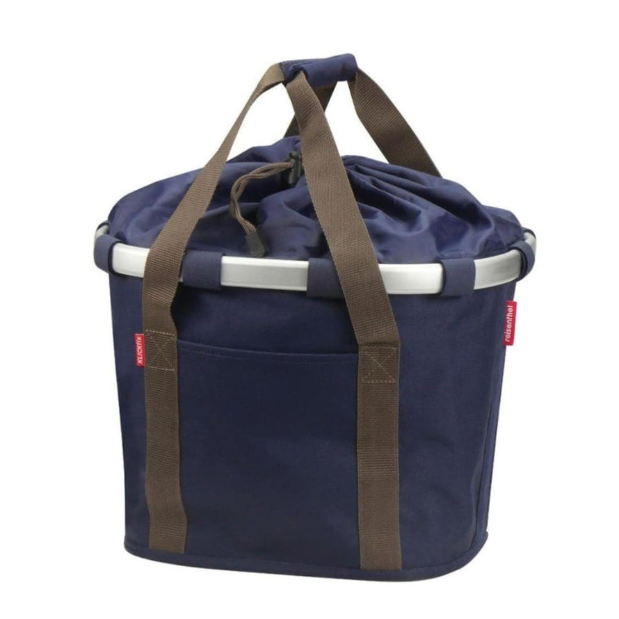 Panier avant vélo Klickfix Bikebasket 15L bleu nuit avec poignées marron, idéal pour balades urbaines et courses
