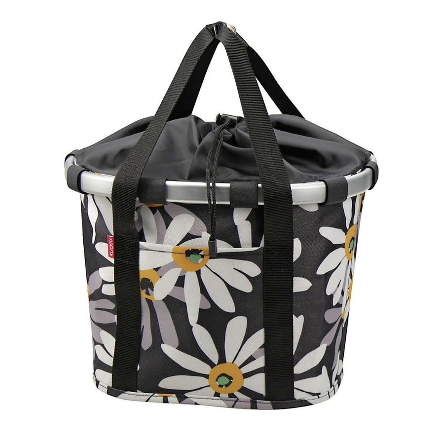Panier avant vélo Klickfix Bikebasket 15L avec motif fleurs blanches sur fond noir, pratique et élégant pour la ville