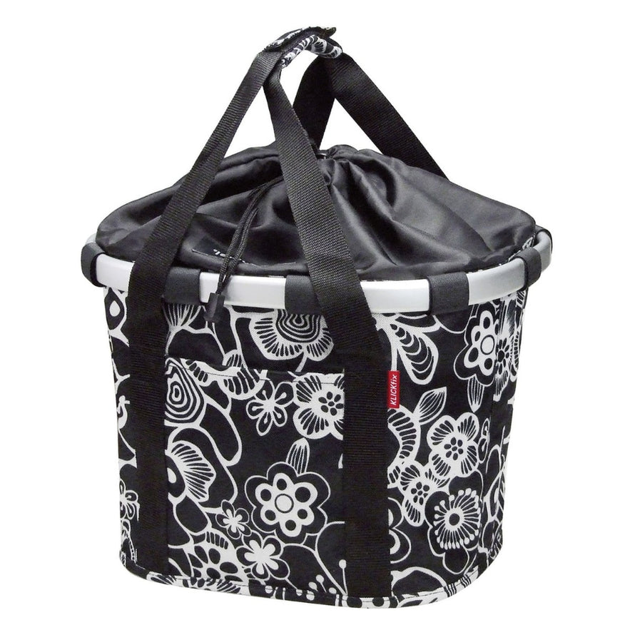 Panier avant vélo Klickfix Bikebasket 15L noir blanc à fleurs avec cordon de fermeture pratique et design urbain