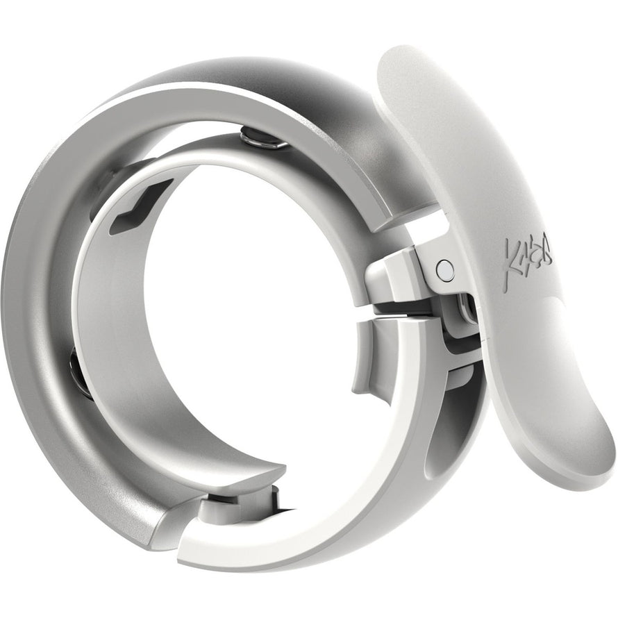 Sonnette Knog Oi Bell Prima Small blanche, design minimaliste et fonctionnel pour vélo urbain