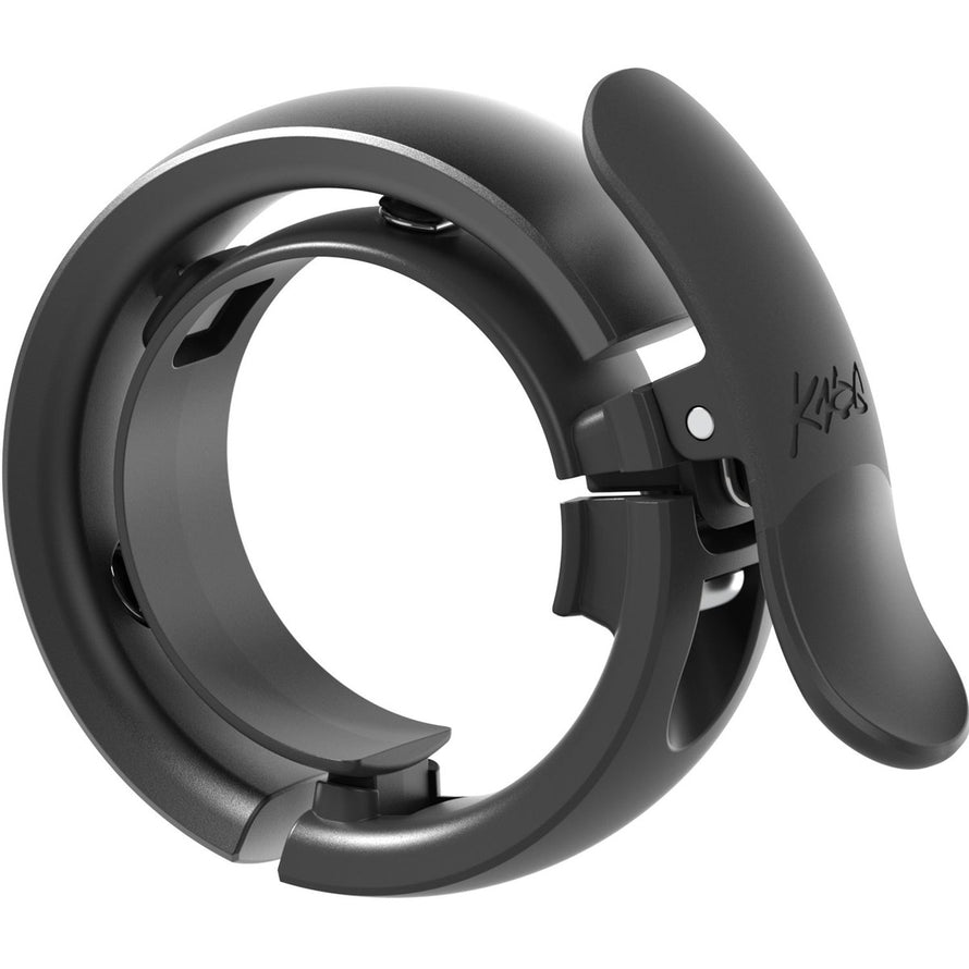 Sonnette vélo Knog Oi Bell Prima Small noire, design compact et élégant pour cyclistes urbains