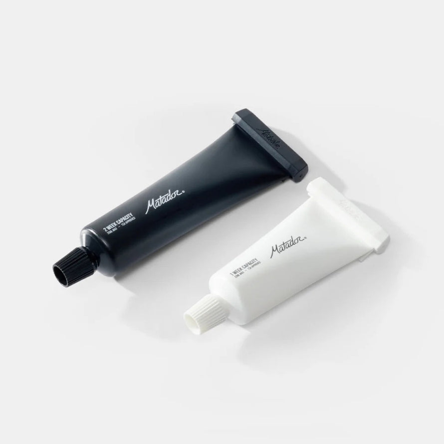 Tubes dentifrice rechargeables Matador 35 ml et 22 ml en noir et blanc, formats pratiques pour voyage et usage quotidien