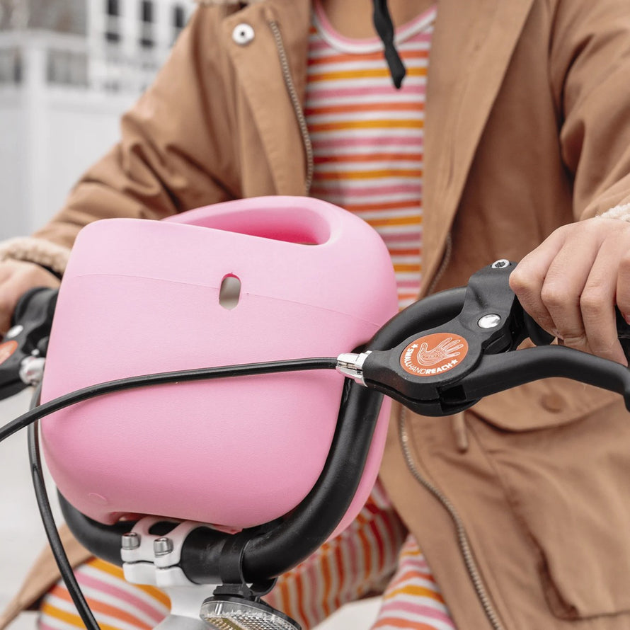 Panier velo enfant woom pop rose pale sur guidon, leger et pratique pour transporter affaires lors des balades