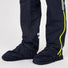 Bas de pantalon Urban Circus Iyuc avec fermeture éclaire latérale et surchaussures intégrées pour protéger les pieds sous la pluie.