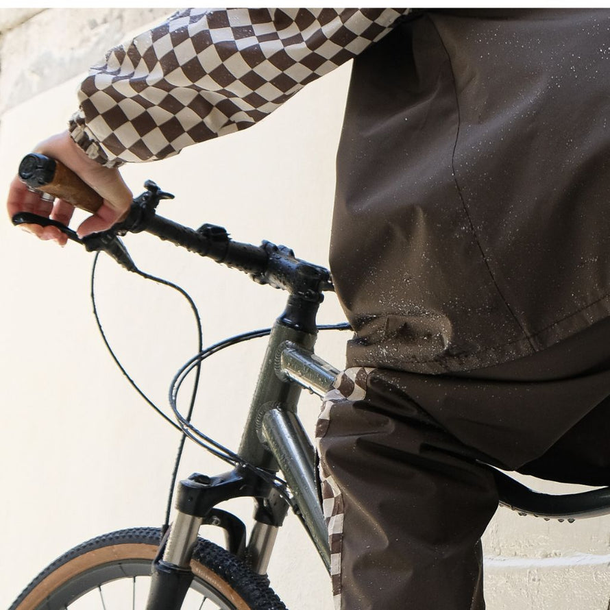 Poncho de pluie court Poule Party adulte  Damier Kaki vélo recyclé urbain ville pratique capuche style original écoresponsable