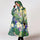 Poncho de pluie vélo recyclé Rainkiss modèle Iris Floral, imperméable et écologique pour cyclistes urbains stylés