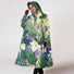 Poncho de pluie vélo recyclé Rainkiss modèle Iris Floral, imperméable et écologique pour cyclistes urbains stylés