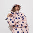Poncho de pluie vélo Vivi Mari imperméable à gros pois bleu sur fond rose avec capuche pour cyclistes urbains