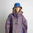 Poncho de pluie vélo Vivi Mari imperméable motif leopard bleu et orange pour cyclistes urbains modernes