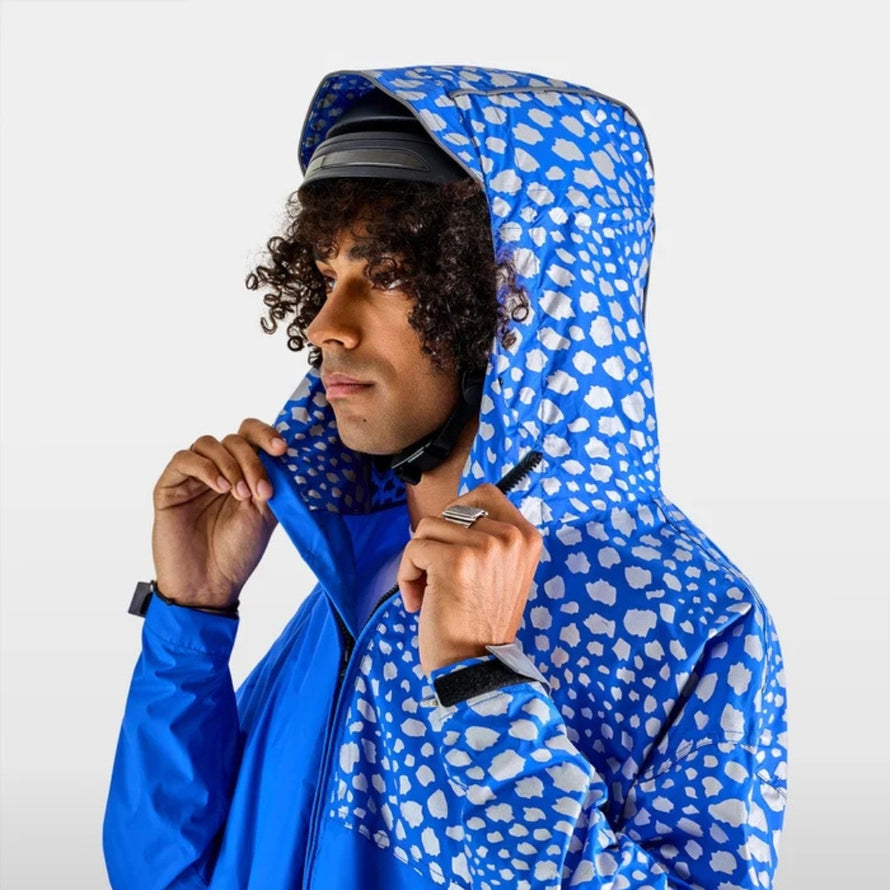 Poncho vélo zippé réfléchissant Urban Circus Francigena bleu motifs clairs pour cyclistes urbains, protection pluie et visibilité optimale