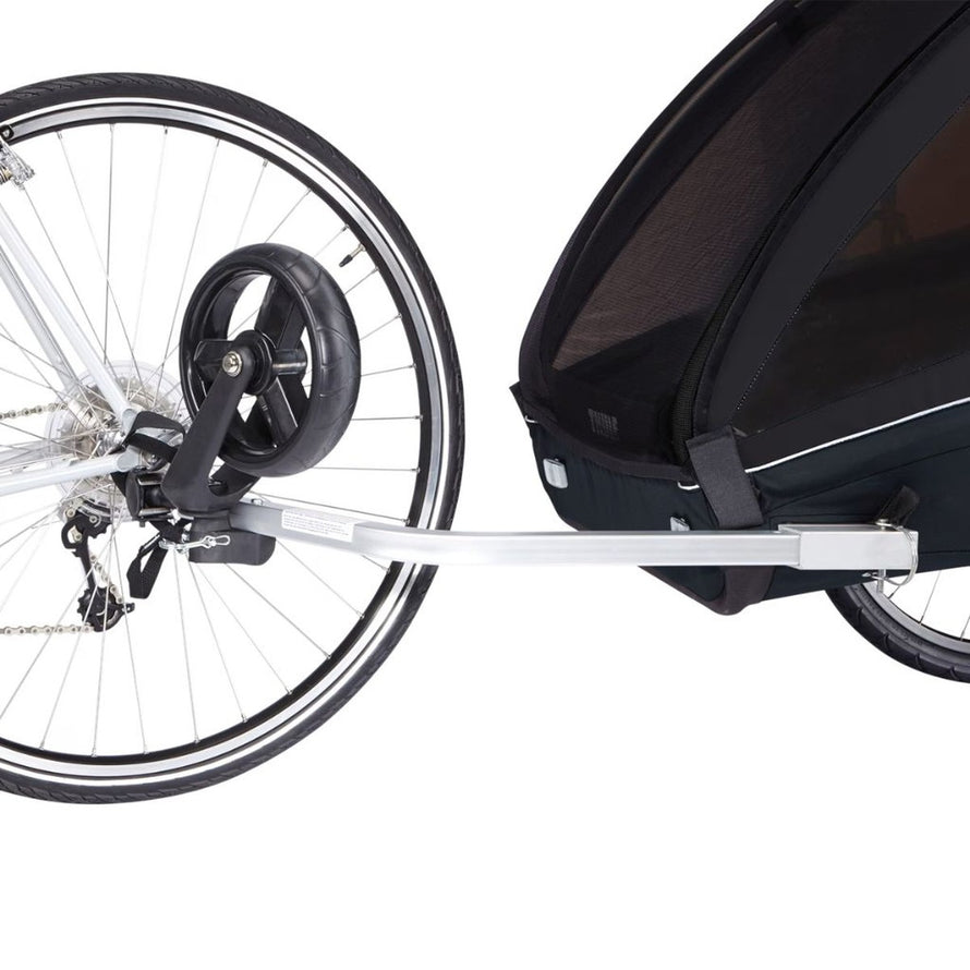 Attelage de la remorque poussette Thule Chariot Coaster XT pour 2 enfants, fixation sécurisée au vélo