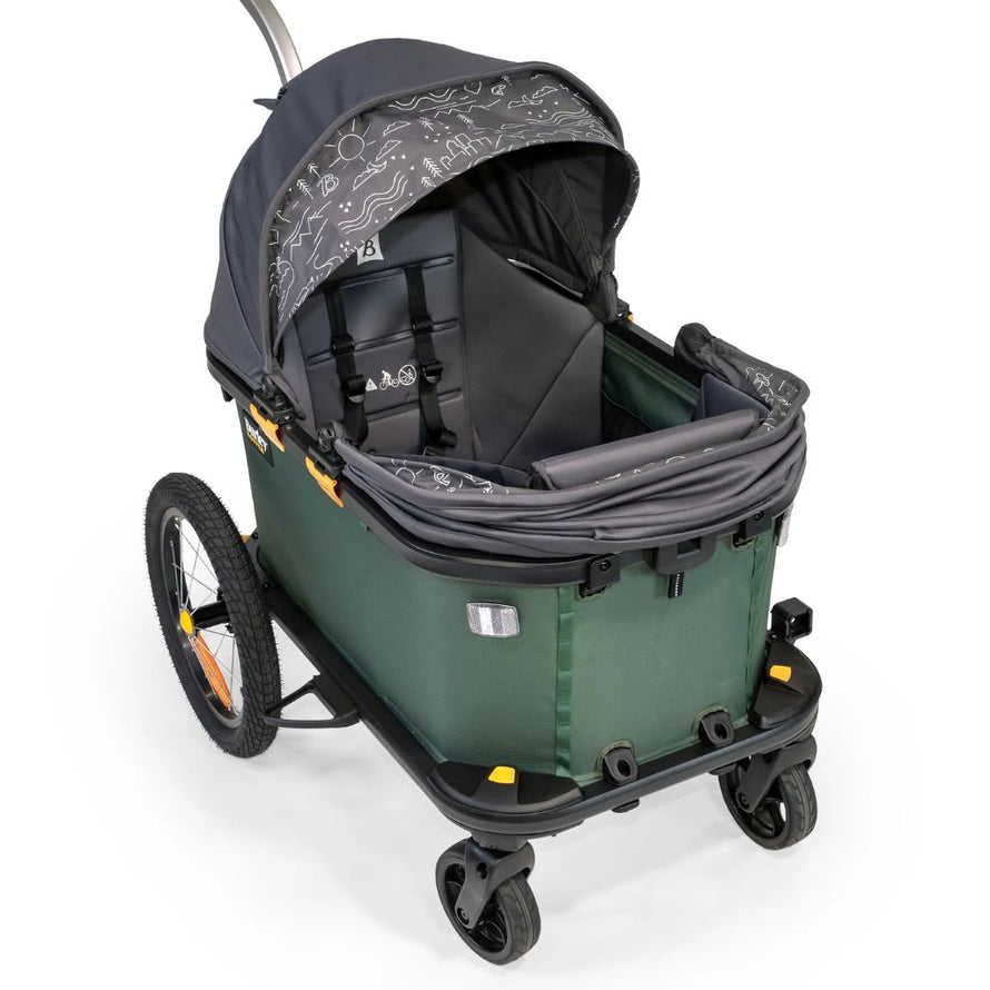 En mode chariot, la remorque vélo Hopper de Burley peut être aménagée en poussette simple ou double avec des sièges enfant amovibles