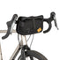 Sacoche guidon 4L Restrap Rolltop Canister en situation de bikepacking vu de profil.