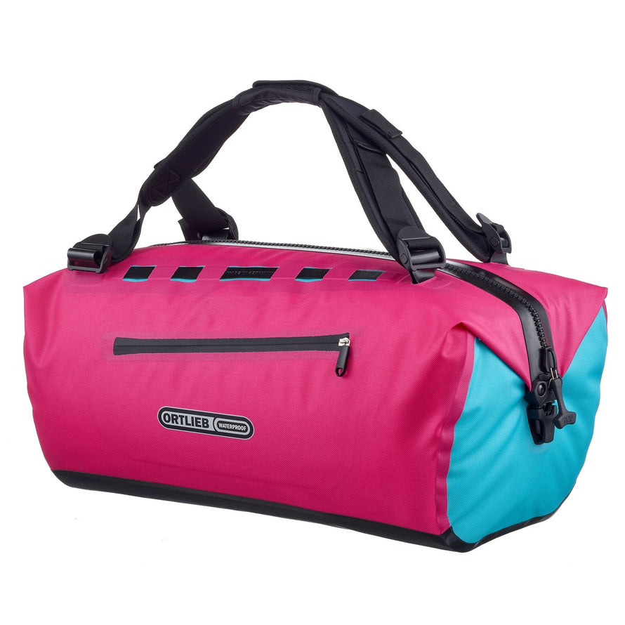 Sac à dos vélo Ortlieb Duffle Lite étanche en rose et bleu, idéal pour voyages et sorties outdoor