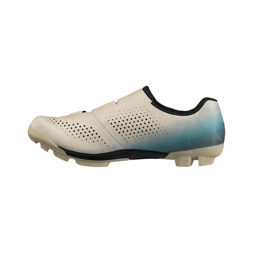 Chaussures gravel homme Shimano SH-RX600 SPD beige et bleu, alliant confort et performance pour cyclisme tout-terrain