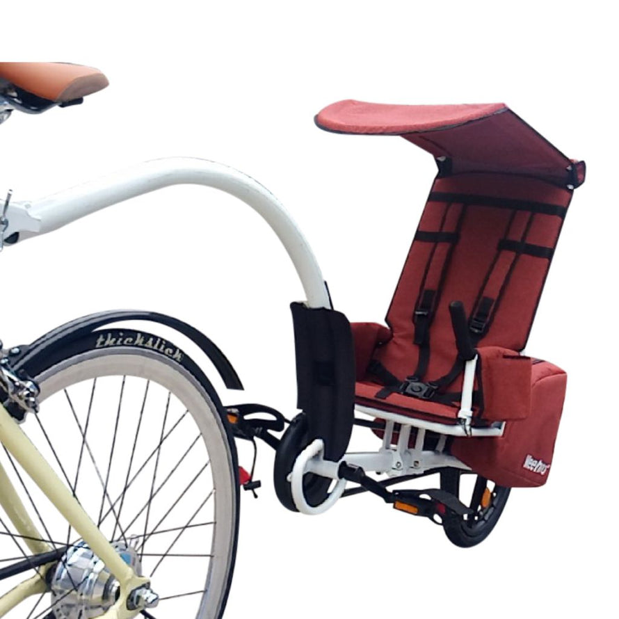 Remorque avec sacoches et pédales pour le transport d'enfants en cyclotourisme 