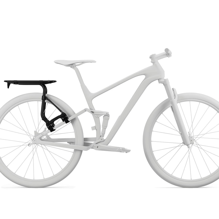 Porte bagage pour sacoches vélo Thule Tour Rack noir fixé sur un vélo moderne