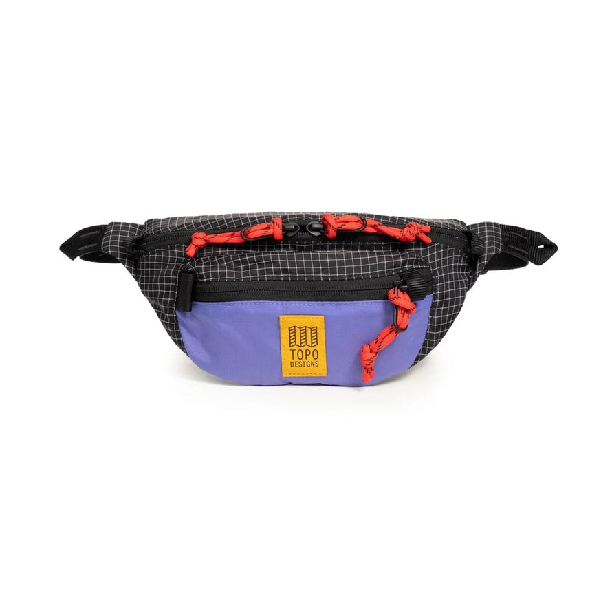 Sacoche banane Topo Designs Mountain Waist Pack 1L noire et violette avec cordons rouges, parfaite pour sorties vélo urbaines