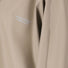 Zoom sur tissu beige de la veste de pluie vélo 66 Weather Report Flame imperméable avec logo