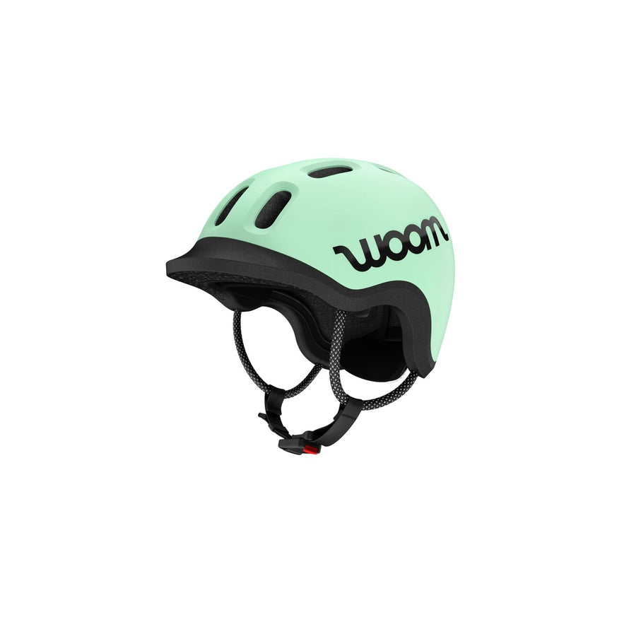 Casque velo woom ready vert clair vue profil avant avec systeme de maintien et ventilation enfant
