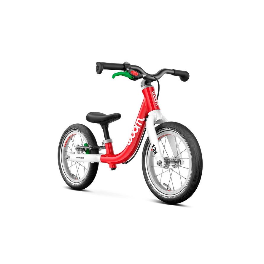 Draisienne rouge Woom GO 1 pour enfants de 18 mois a 3.5 ans avec frein ergonomique vert