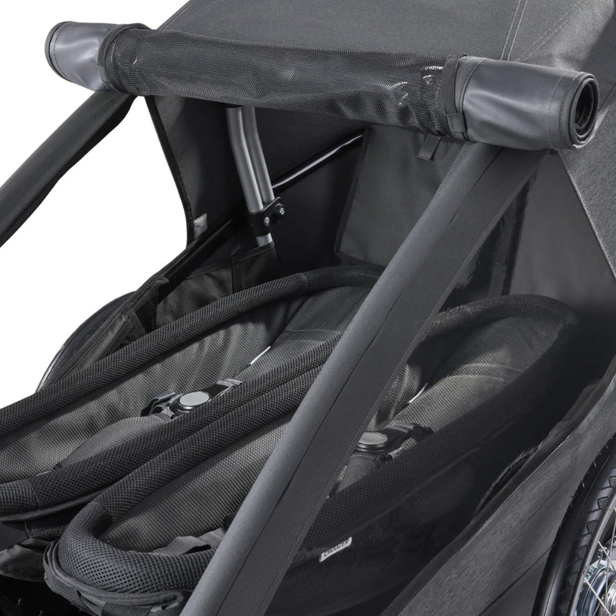 Couchette bébé Yuuna Croozer pour remorque vélo, offrant confort et protection optimale pour les petits passagers